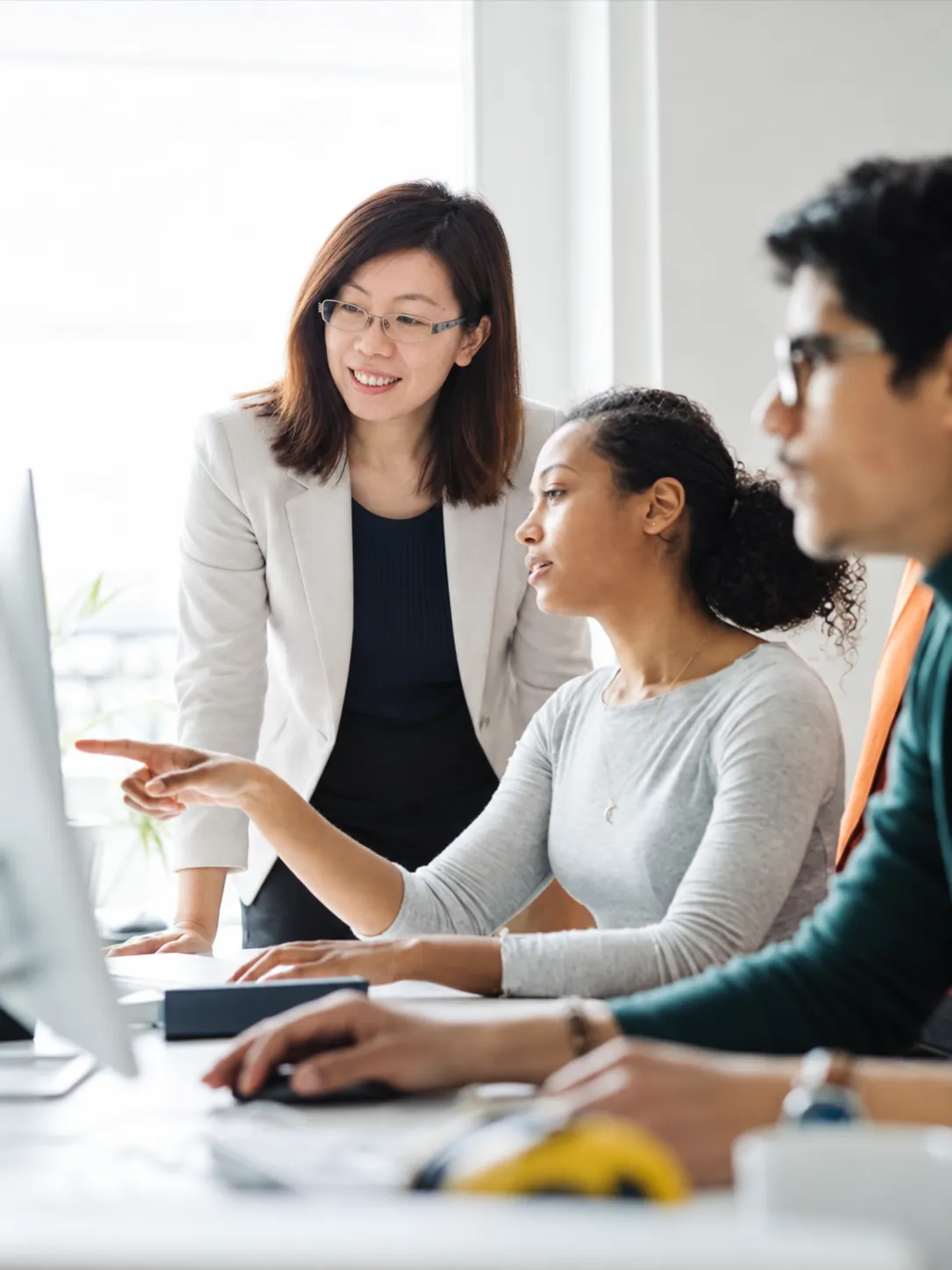 Skyline team collaborating around a workstation